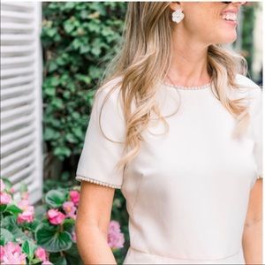 Cream colored jumpsuit with pearl trim